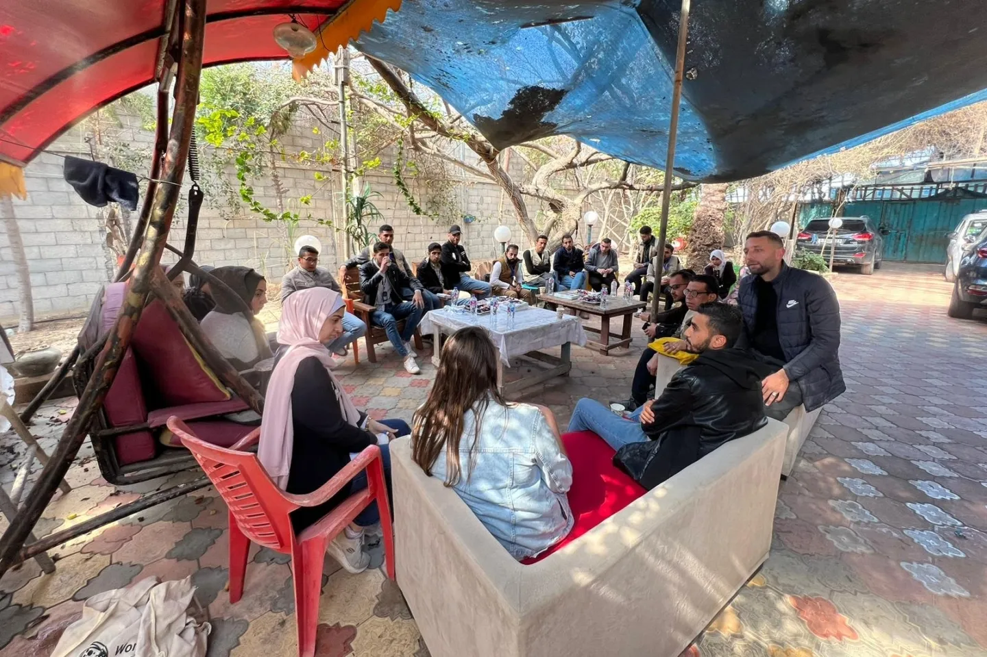 group of people sitting outside together